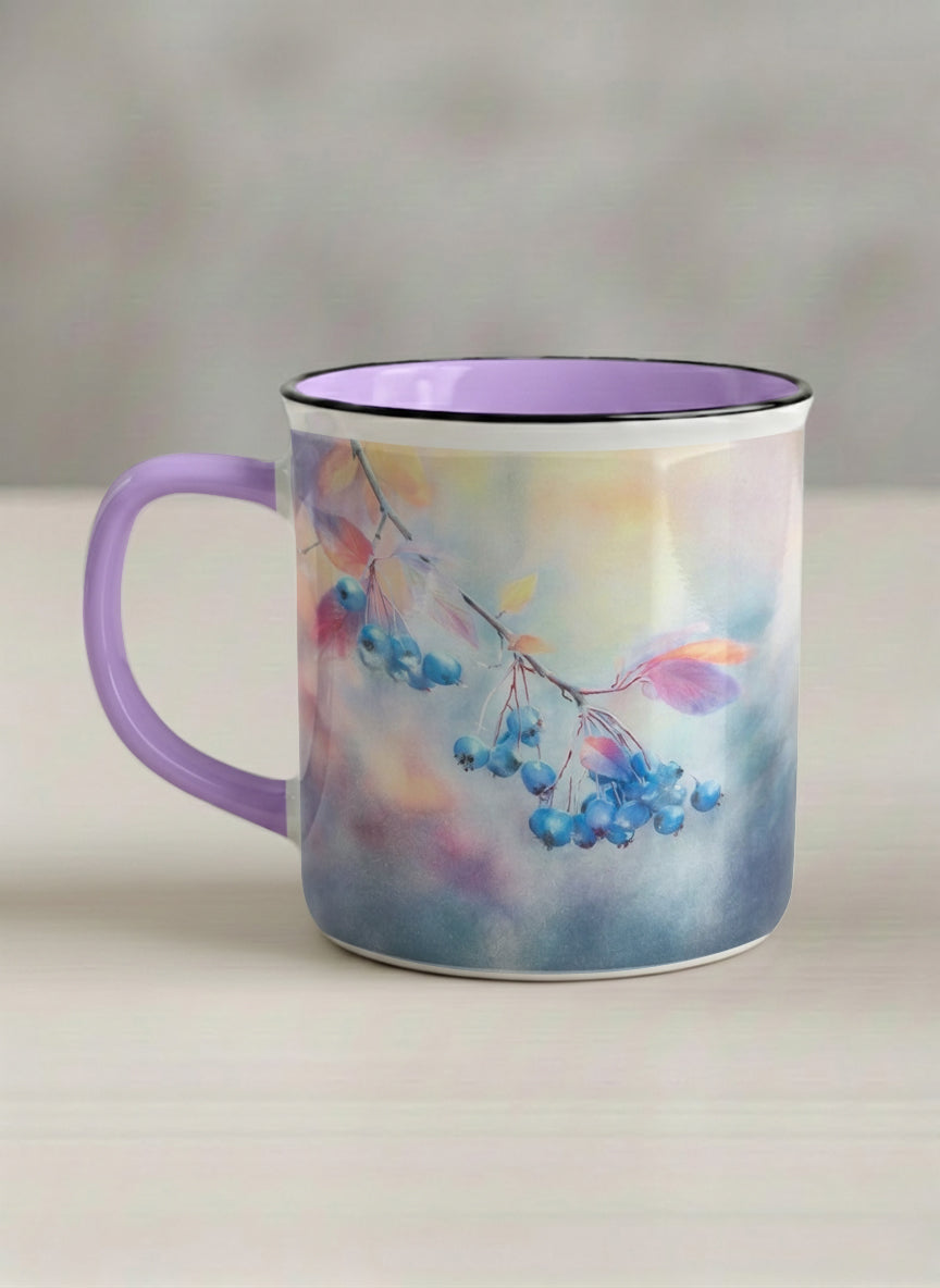 enamel mug | Frosted Morning left view mug, vivid blue berries and autumn leaves drifting across a dreamy pastel rainbow wash, soft lavender interior and handle, by Karina Mosser - Gallery By Inhesion