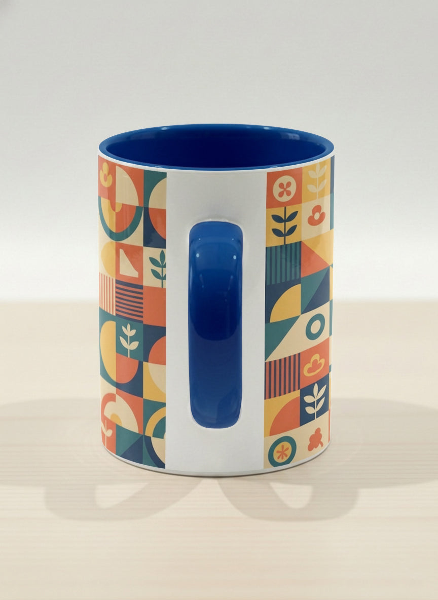 Hero Mug | Bloom Across Realities side view mug, bold geometric pattern, blue interior and handle, concrete surface by Alan CL Lee - Gallery By Inhesion