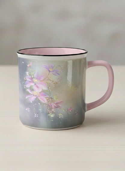 Enamel mug | Ethereal Blossoms mug, soft pink clematis flowers glowing against a deep moody sage green mist, blush pink interior and handle, by Karina Mosser - Gallery By Inhesion