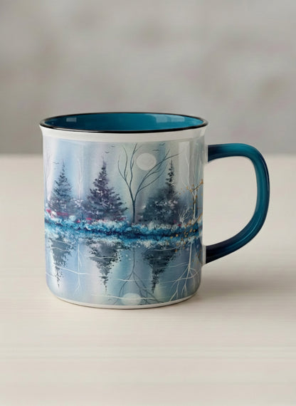 Enamel Mug | Winter Reflections on a Frosted Slope mug showing a serene landscape with trees, water, and a moon design by Renee Pupetz - Gallery By Inhesion