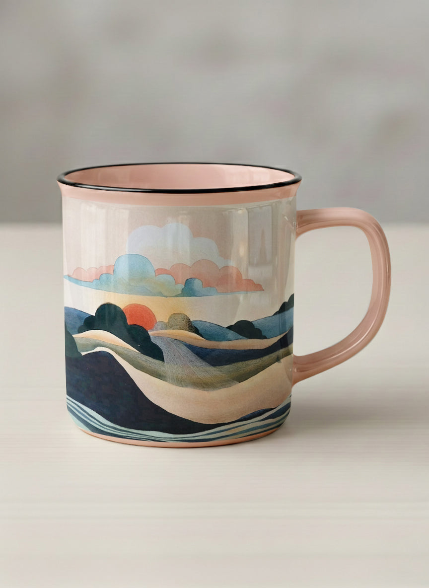 Enamel mug | Sunset at the River mug rolling hills and dark treetops beneath a soft peach sky with blush and teal clouds and a glowing setting sun, warm peach interior and handle, by KikaG - Gallery By Inhesion