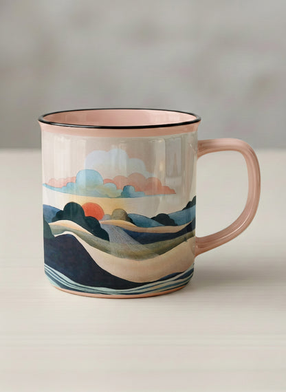 Enamel mug | Sunset at the River mug rolling hills and dark treetops beneath a soft peach sky with blush and teal clouds and a glowing setting sun, warm peach interior and handle, by KikaG - Gallery By Inhesion