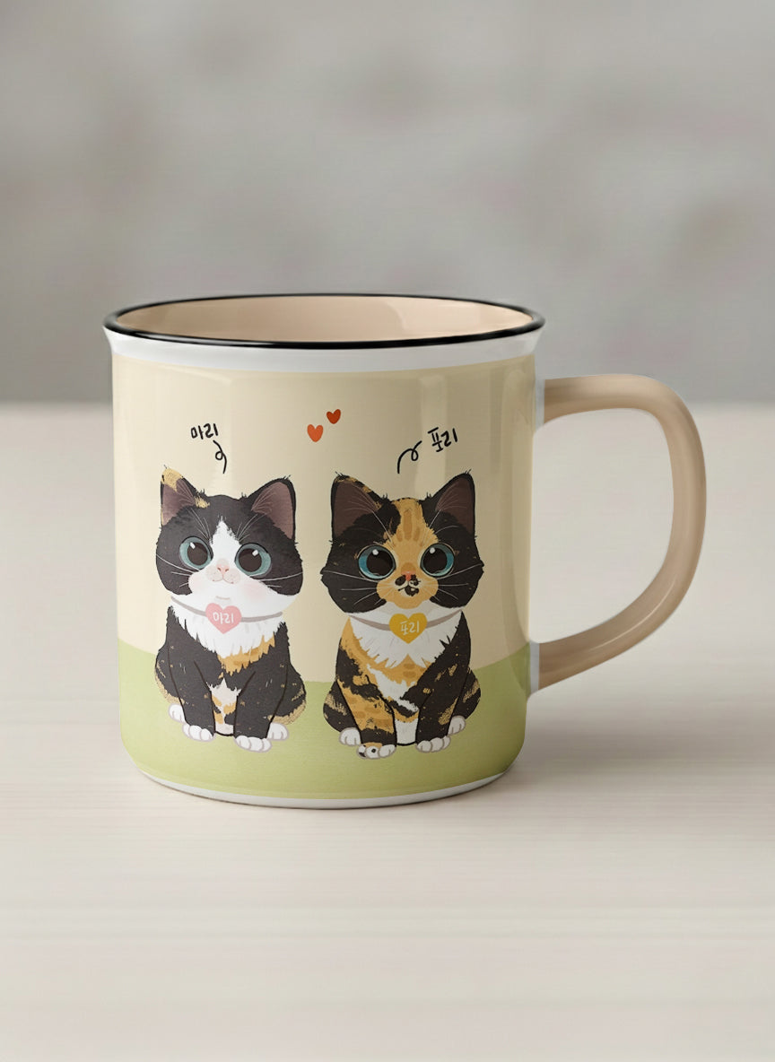 Enamel mug | Our Precious Pair mug, two adorable tuxedo cats side by side with Korean name tags and tiny red hearts, soft cream interior and handle, by Hyun Jung Cho - Gallery By Inhesion