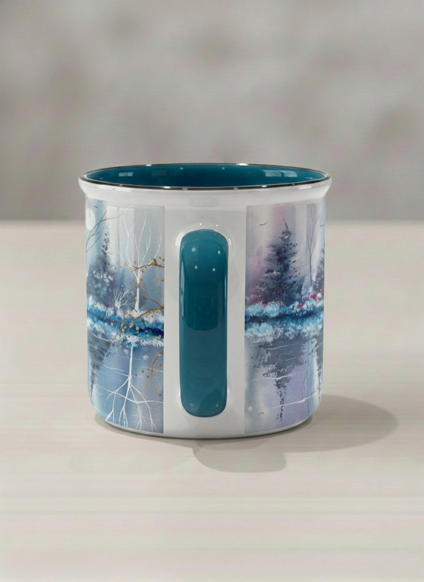 Enamel Mug | Winter Reflections on a Frosted Slope side view mug showing a serene landscape with trees, water, and a moon design by Renee Pupetz - Gallery By Inhesion
