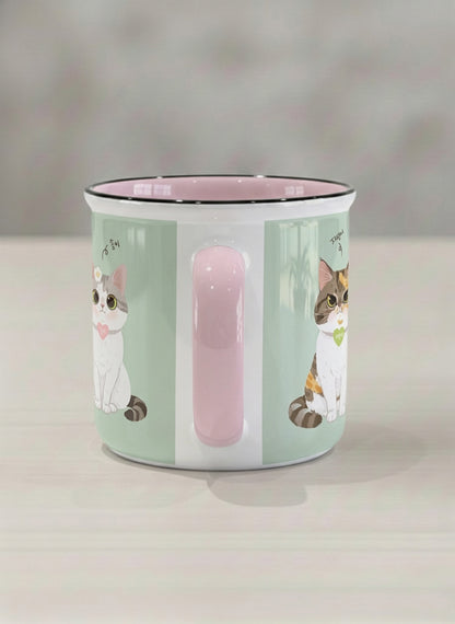 Enamel Mug | The Perfect Pair side view mug two cats with Korean name tags and bow ties on mint green, blush pink interior, by Hyun Jung Cho