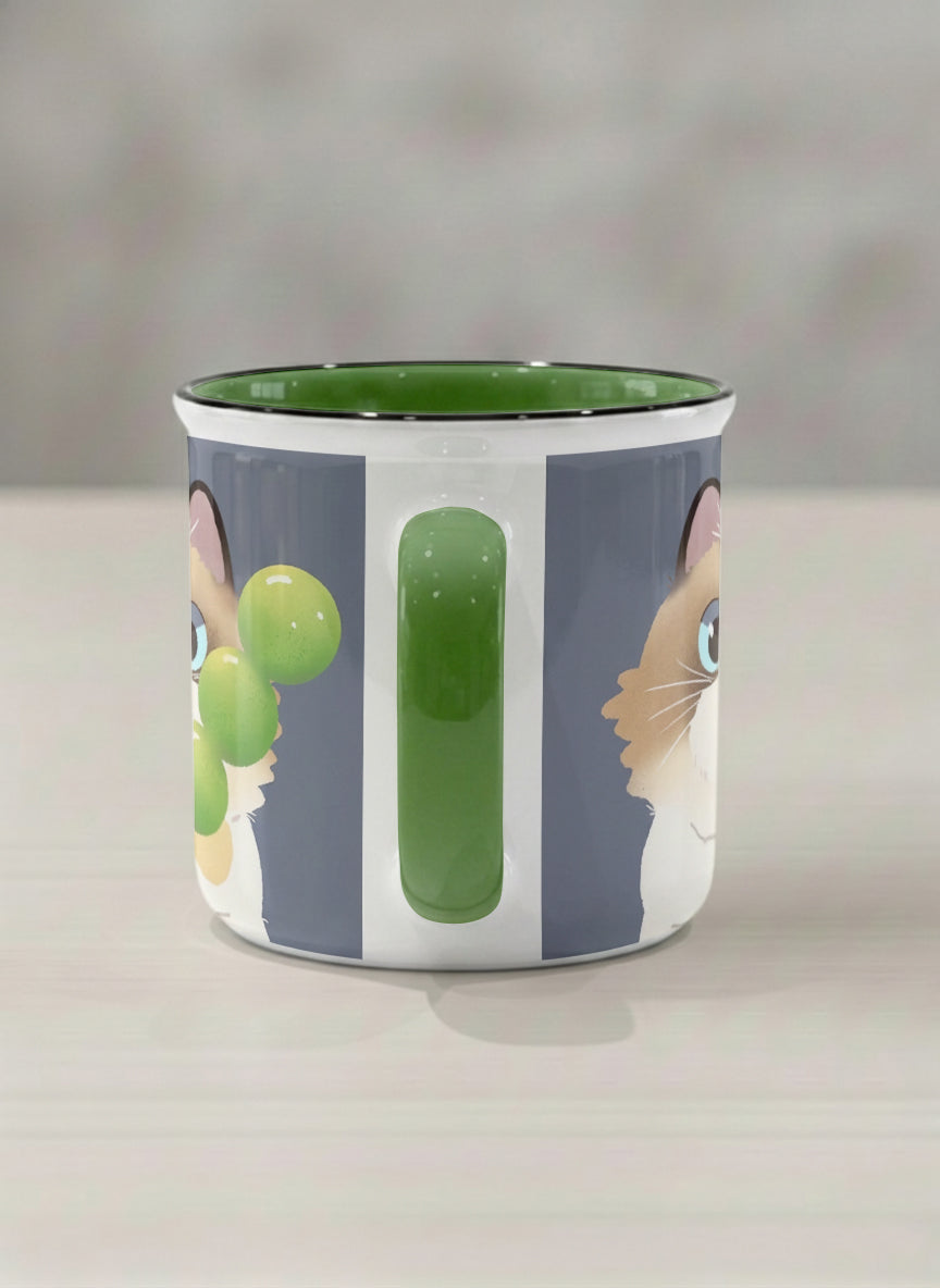 Enamel Mug | My Shiny Treat side view mug grumpy fluffy cat clutching green grapes, tiny red mushroom hat, slate blue background, green interior, by Hyun Jung Cho