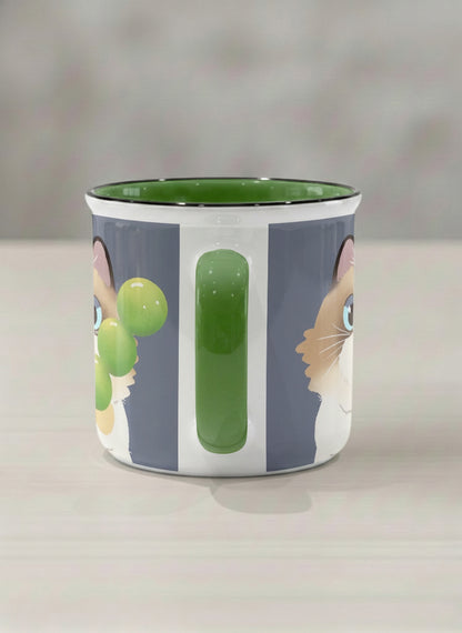 Enamel Mug | My Shiny Treat side view mug grumpy fluffy cat clutching green grapes, tiny red mushroom hat, slate blue background, green interior, by Hyun Jung Cho