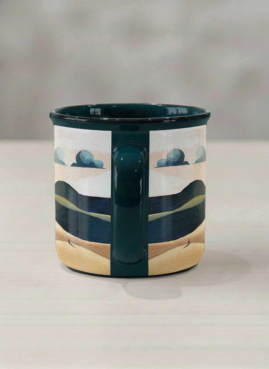 Enamel mug | Share a Sunset side view mug a lone figure walking through rolling sand dunes beneath a glowing orange sun and layered teal clouds, deep teal interior and handle, by KikaG - Gallery By Inhesion