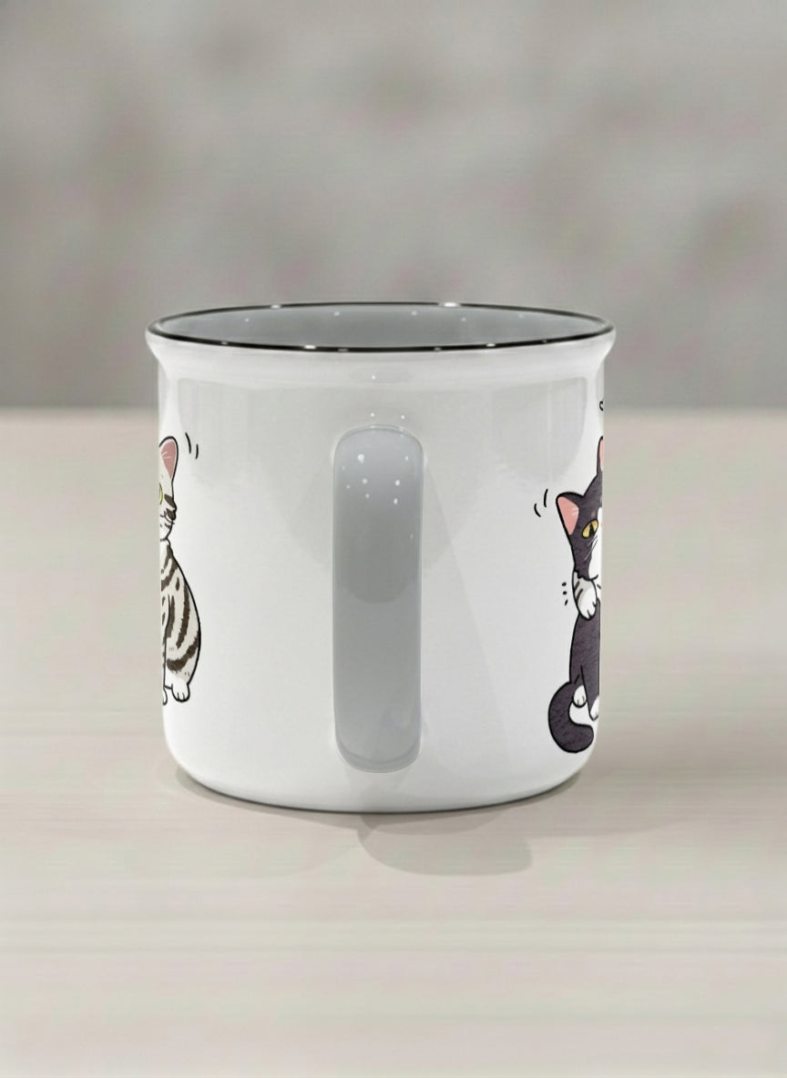 enamel Mug | Best Buddies side view mug small tuxedo cat leaning into a chubby tabby with tiny floating hearts, sage interior, by Hyun Jung Cho