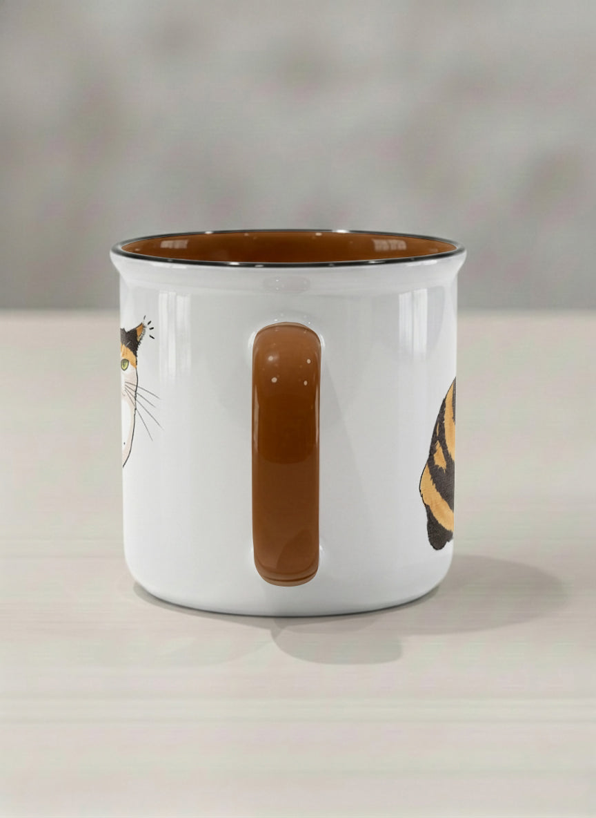 enamel Mug | Spicy Calico side view mug grumpy calico cat with piercing green eyes and ruffled fur, dark chocolate interior, by Hyun Jung Cho