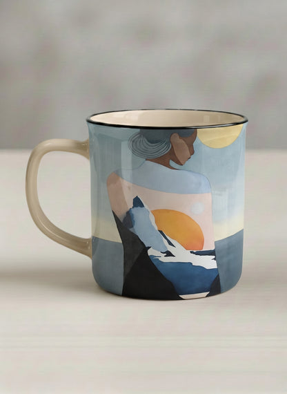enamel mug | A Mountain to Climb left view mug woman gazing over jagged peaks and a golden sun on teal horizon, butter yellow interior, by KikaG - Gallery By Inhesion