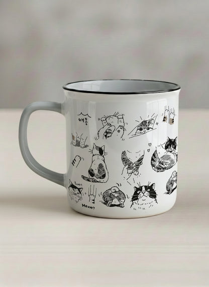 enamel mug | Moments of Curiosity left view mug  ink-sketched cats in playful poses with Korean script on white, grey interior, by Hyun Jung Cho