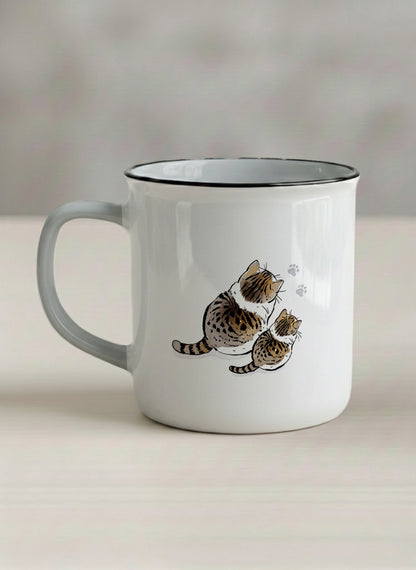 enamel mug | By Your left view mug with two cats and paw prints, by Hyun Jung Cho- Gallery By Inhesion