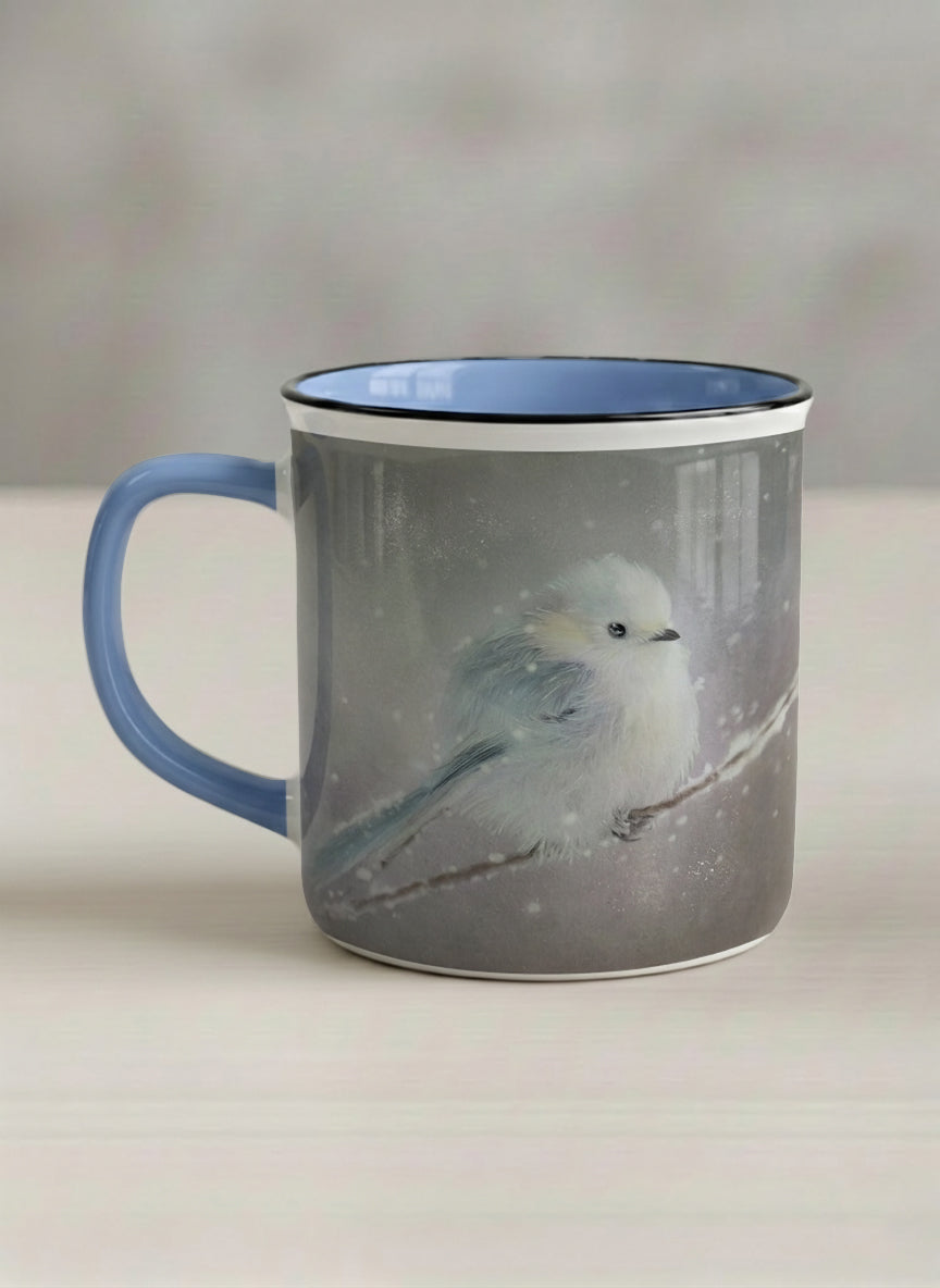 enamel mug | A Moment in the Snow left view mug, a fluffy white bird perched quietly in a soft wintry haze, sky blue interior and handle, by Karina Mosser - Gallery By Inhesion