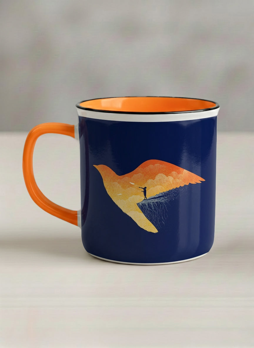 Enamel Mug | Dream Big left view mug with surreal flying bird illustration in sunset colors by Tang Yau Hoong - Gallery By Inhesion