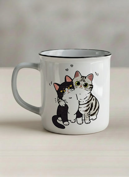 enamel Mug | Best Buddies left view mug small tuxedo cat leaning into a chubby tabby with tiny floating hearts, sage interior, by Hyun Jung Cho