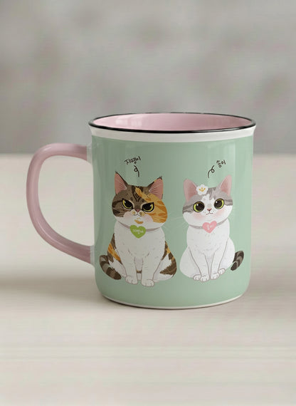 Enamel Mug | The Perfect Pair left view mug two cats with Korean name tags and bow ties on mint green, blush pink interior, by Hyun Jung Cho