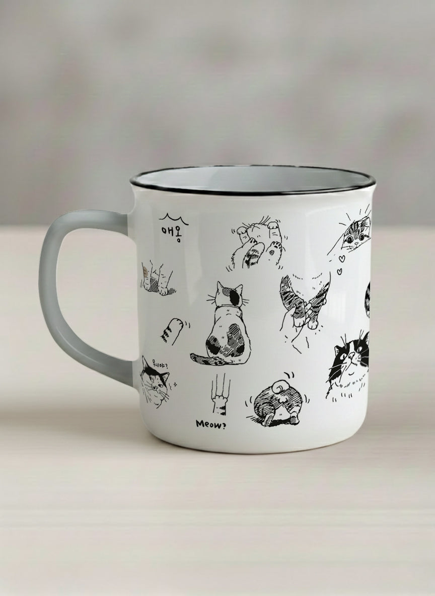 Enamel mug | Moments of Curiosity left view mug  ink-sketched cats in playful poses with Korean script on white, grey interior, by Hyun Jung Cho