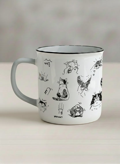 Enamel mug | Moments of Curiosity left view mug  ink-sketched cats in playful poses with Korean script on white, grey interior, by Hyun Jung Cho