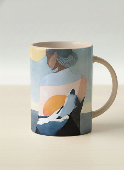 hero mug | A Mountain to Climb mug woman gazing over jagged peaks and a golden sun on teal horizon, butter yellow interior, by KikaG - Gallery By Inhesion