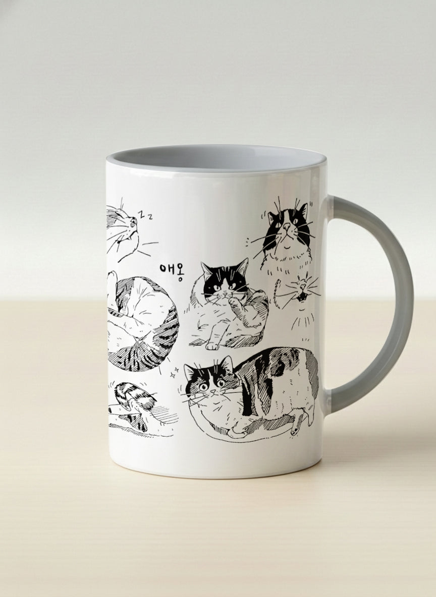 hero mug | Moments of Curiosity mug  ink-sketched cats in playful poses with Korean script on white, grey interior, by Hyun Jung Cho