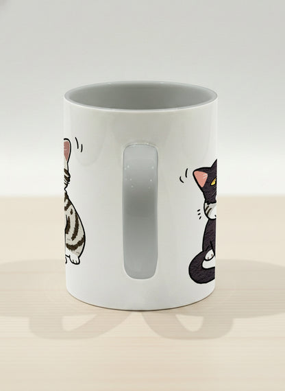 hero mug | Best Buddies side view mug small tuxedo cat leaning into a chubby tabby with tiny floating hearts, sage interior, by Hyun Jung Cho