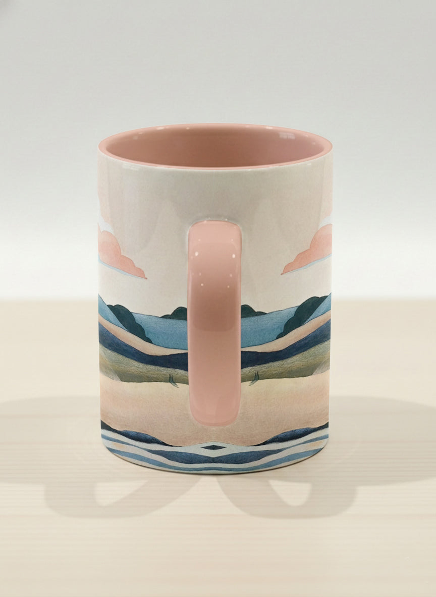 hero mug | Sunset at the River side view mug rolling hills and dark treetops beneath a soft peach sky with blush and teal clouds and a glowing setting sun, warm peach interior and handle, by KikaG - Gallery By Inhesion