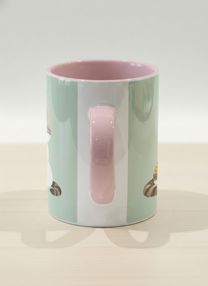 Hero Mug | The Perfect Pair side view mug two cats with Korean name tags and bow ties on mint green, blush pink interior, by Hyun Jung Cho