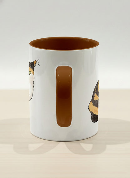 hero Mug | Spicy Calico side view mug grumpy calico cat with piercing green eyes and ruffled fur, dark chocolate interior, by Hyun Jung Cho