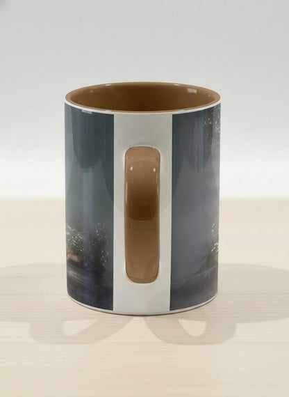 Hero mug | Serenity Stream side view mug, an enchanted forest with glowing light filtering through misty teal trees and wildflowers by a stream, warm olive interior and handle, by Karina Mosser - Gallery By Inhesion
