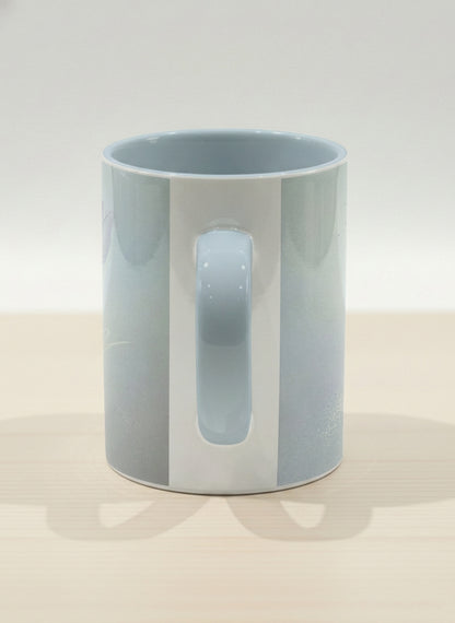 hero mug | Glass Petals side view mug, a delicate translucent poppy bloom emerging from a soft misty blue-grey wash, matching powder blue interior and handle, by Karina Mosser - Gallery By Inhesion