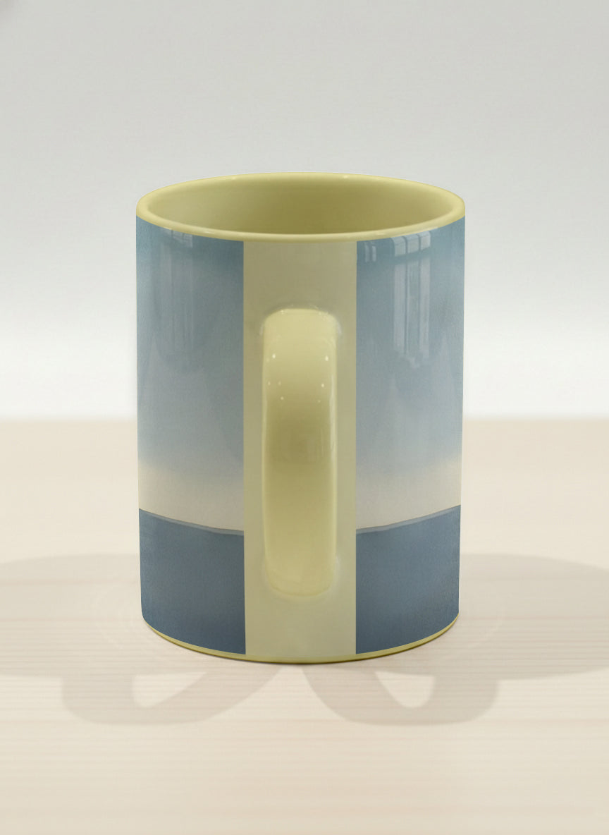 Hero mug | A Mountain to Climb side view mug woman gazing over jagged peaks and a golden sun on teal horizon, butter yellow interior, by KikaG - Gallery By Inhesion
