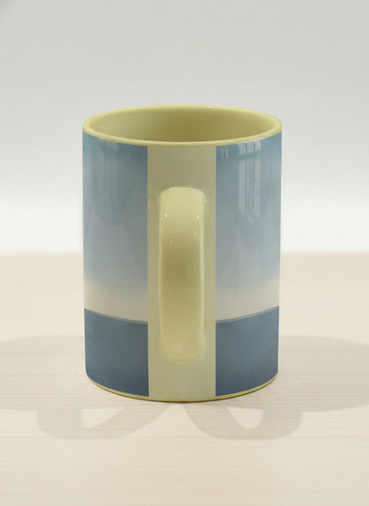 Hero mug | A Mountain to Climb side view mug woman gazing over jagged peaks and a golden sun on teal horizon, butter yellow interior, by KikaG - Gallery By Inhesion
