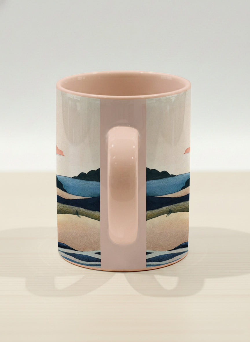 hero mug | Sunset at the River side view mug rolling hills and dark treetops beneath a soft peach sky with blush and teal clouds and a glowing setting sun, warm peach interior and handle, by KikaG - Gallery By Inhesion