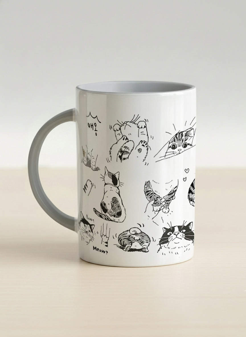hero mug | Moments of Curiosity left view mug  ink-sketched cats in playful poses with Korean script on white, grey interior, by Hyun Jung Cho