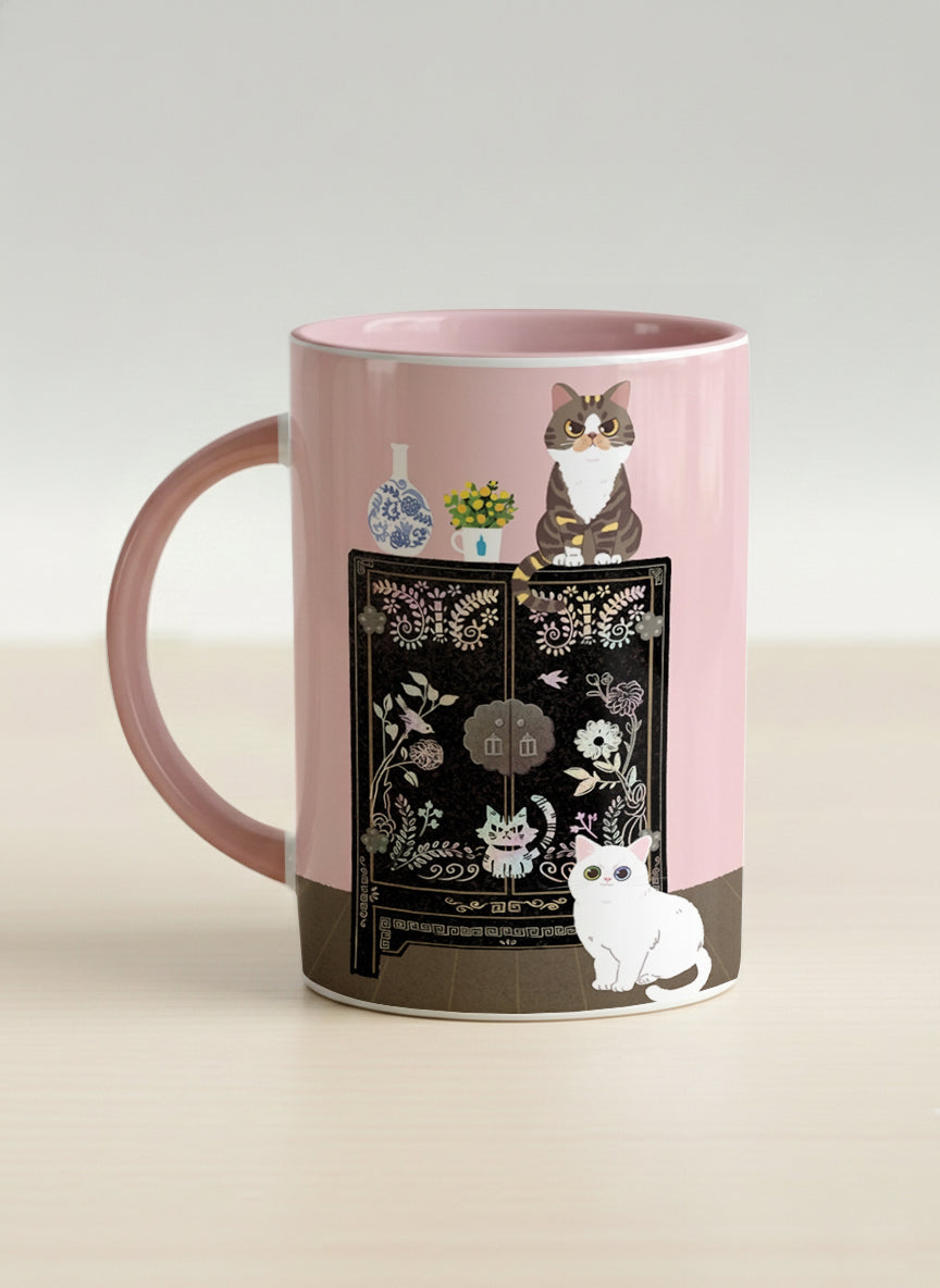 Hero Mug | Korean Beauty & Felines left view mug cats by ornate black lacquer cabinet with floral carvings, blush pink interior, by Hyun Jung Cho