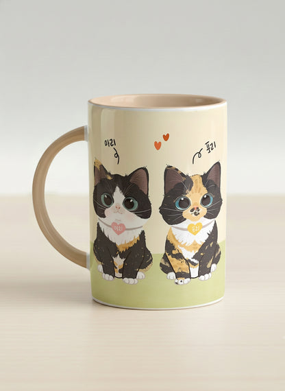 Hero mug | Our Precious Pair left view mug, two adorable tuxedo cats side by side with Korean name tags and tiny red hearts, soft cream interior and handle, by Hyun Jung Cho - Gallery By Inhesion
