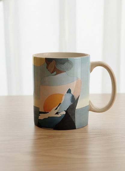 classic mug | A Mountain to Climb mug woman gazing over jagged peaks and a golden sun on teal horizon, butter yellow interior, by KikaG - Gallery By Inhesion