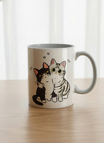 classic Mug | Best Buddies mug small tuxedo cat leaning into a chubby tabby with tiny floating hearts, sage interior, by Hyun Jung Cho
