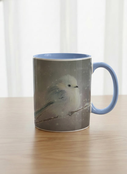classic mug | A Moment in the Snow mug, a fluffy white bird perched quietly in a soft wintry haze, sky blue interior and handle, by Karina Mosser - Gallery By Inhesion