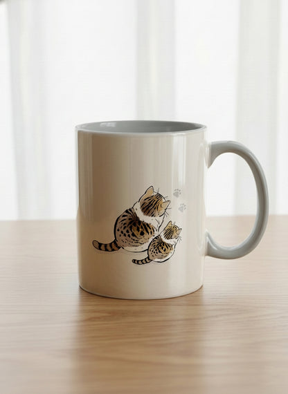 classic mug | By Your Side mug with two cats and paw prints, by Hyun Jung Cho- Gallery By Inhesion