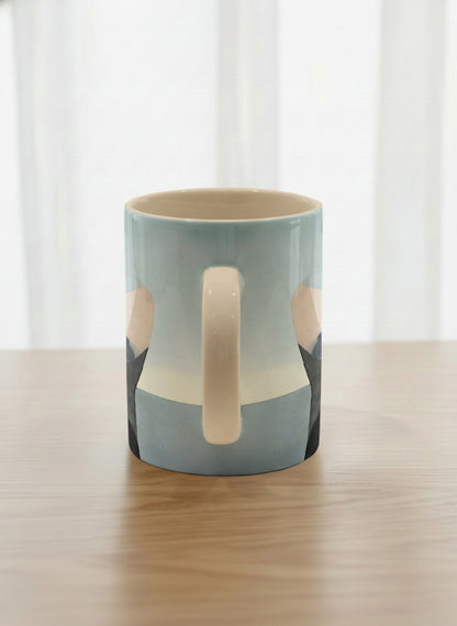 classic mug | A Mountain to Climb side view mug woman gazing over jagged peaks and a golden sun on teal horizon, butter yellow interior, by KikaG - Gallery By Inhesion
