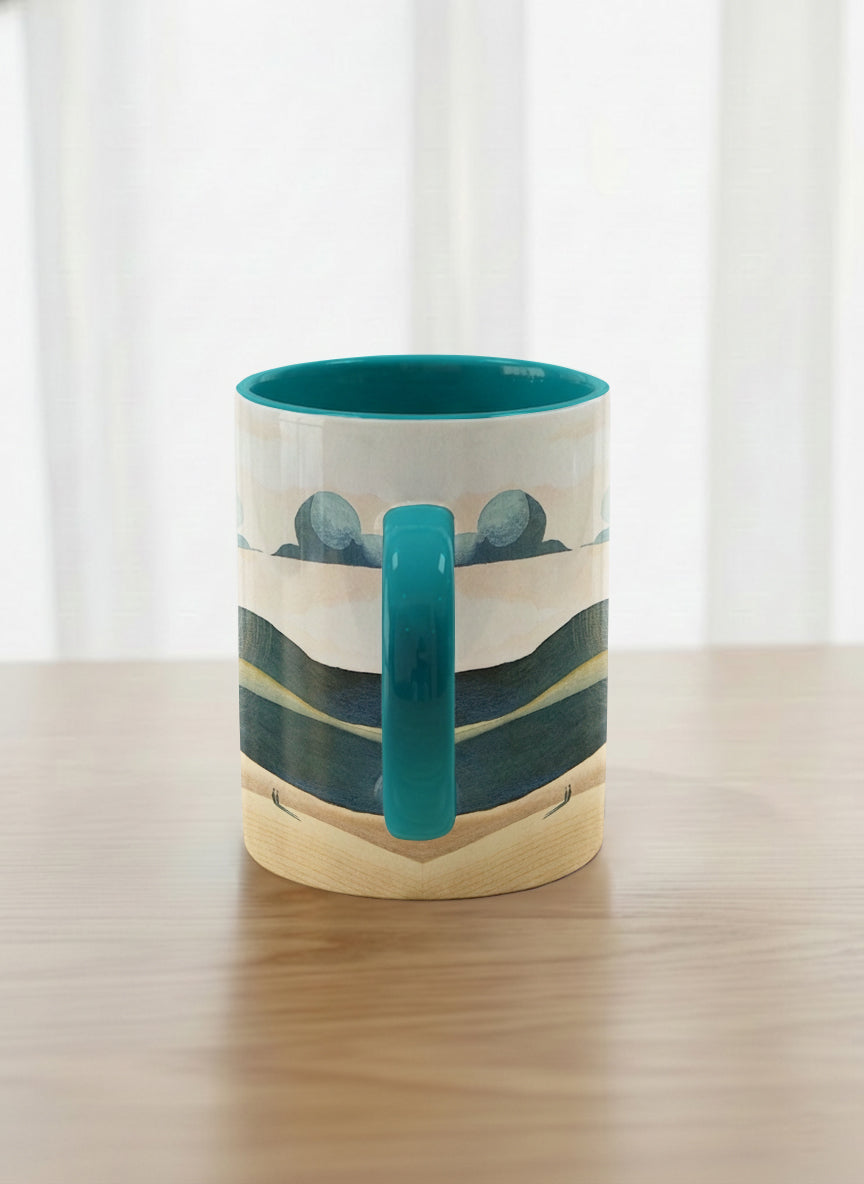 classic mug | Share a Sunset side view  mug a lone figure walking through rolling sand dunes beneath a glowing orange sun and layered teal clouds, deep teal interior and handle, by KikaG - Gallery By Inhesion