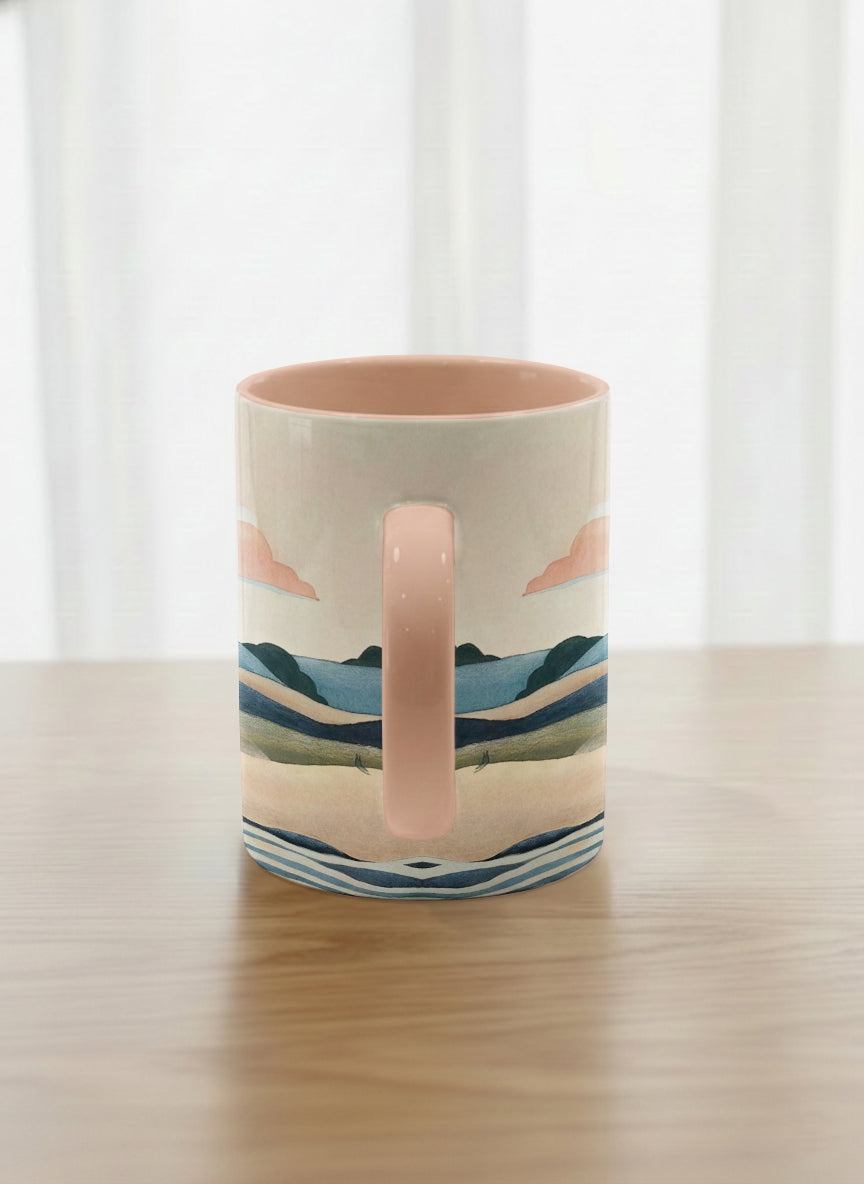 classic mug | Sunset at the River side view mug rolling hills and dark treetops beneath a soft peach sky with blush and teal clouds and a glowing setting sun, warm peach interior and handle, by KikaG - Gallery By Inhesion