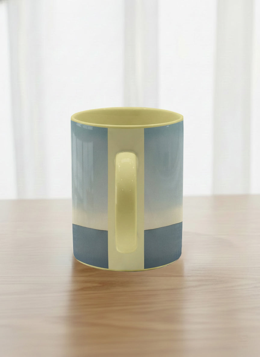 Classic Mug | A Mountain to Climb side view mug woman gazing over jagged peaks and a golden sun on teal horizon, butter yellow interior, by KikaG - Gallery By Inhesion

