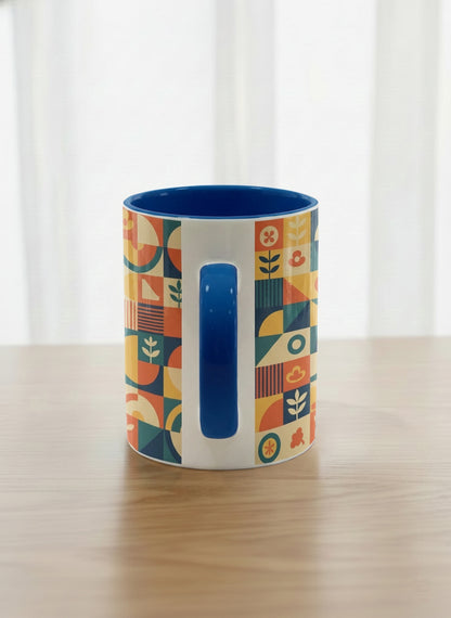 Classic Mug | Bloom Across Realities side view mug, bold geometric pattern, blue interior and handle, concrete surface  by Alan CL Lee - Gallery By Inhesion