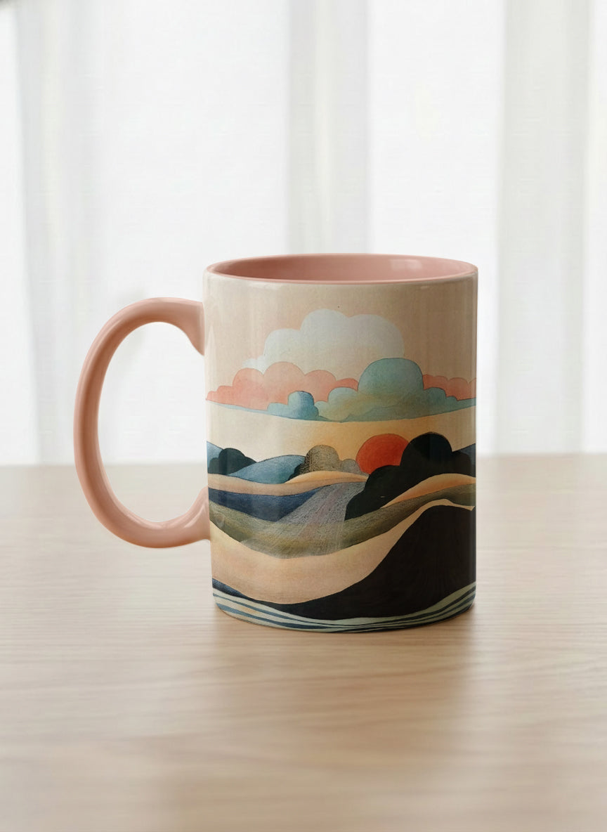 classic mug | Sunset at the River left view mug rolling hills and dark treetops beneath a soft peach sky with blush and teal clouds and a glowing setting sun, warm peach interior and handle, by KikaG - Gallery By Inhesion