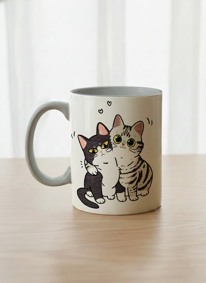 classic mug | Best Buddies left view mug small tuxedo cat leaning into a chubby tabby with tiny floating hearts, sage interior, by Hyun Jung Cho