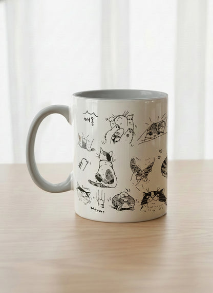 Classic mug | Moments of Curiosity left view mug  ink-sketched cats in playful poses with Korean script on white, grey interior, by Hyun Jung Cho