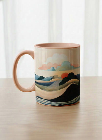Classic mug | Sunset at the River left view mug rolling hills and dark treetops beneath a soft peach sky with blush and teal clouds and a glowing setting sun, warm peach interior and handle, by KikaG - Gallery By Inhesion